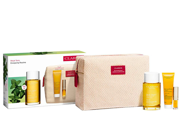 Fotoja e Set Vaj për trup 100 ml + Tonik për banjë dhe dush 30 ml + Vaj për buzë 1.4 ml + Çantë kozmetike Clarins Ritual Kit