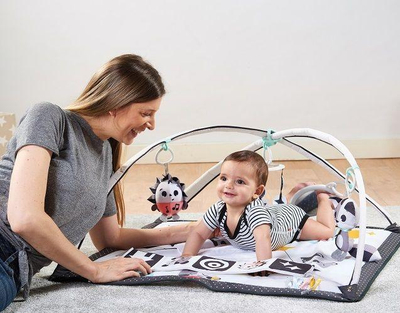 Tendë me lodra për fëmijë Tiny Love Magical Tales Kick & Play Gymini